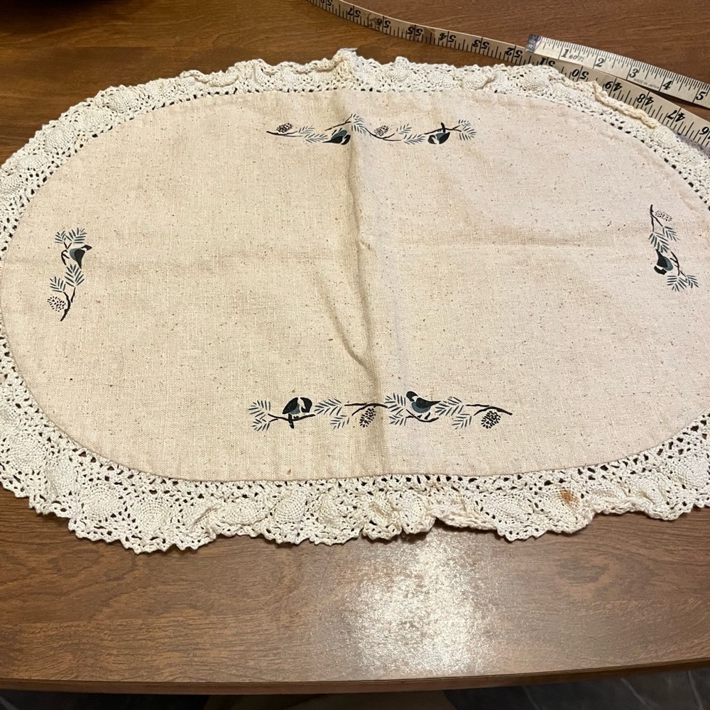 Table doily with birds on
